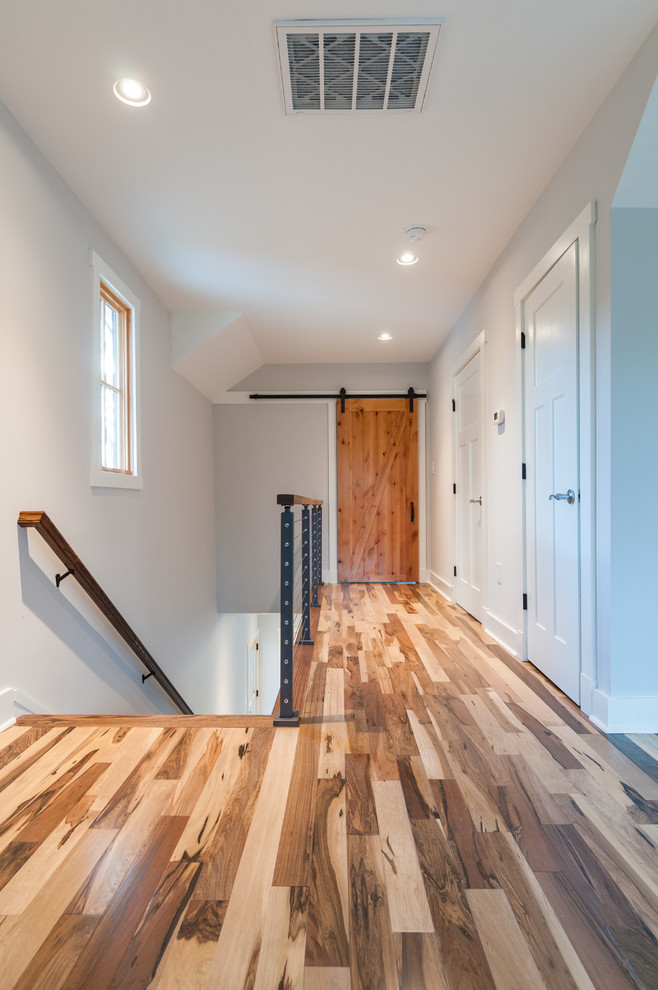 Example of a mid-sized country hallway design in Richmond with white walls