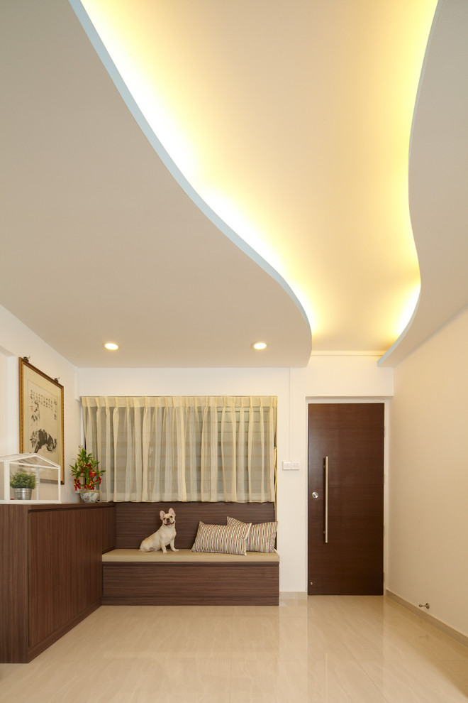 Example of a small asian porcelain tile hallway design in Singapore with white walls