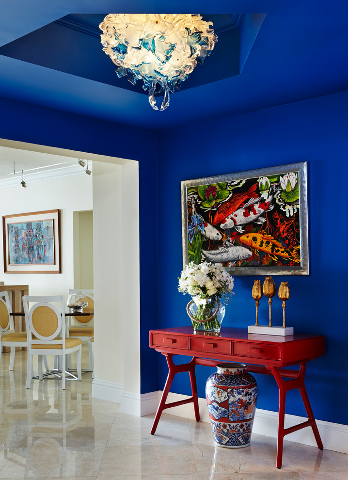 Hallway - tropical hallway idea in Other with blue walls