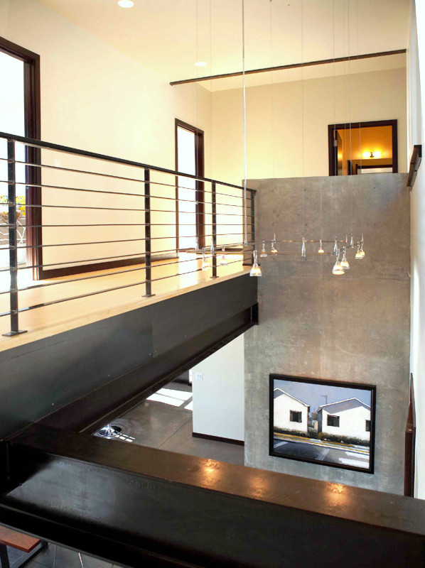 Mid-sized minimalist concrete floor and beige floor hallway photo in Seattle with white walls