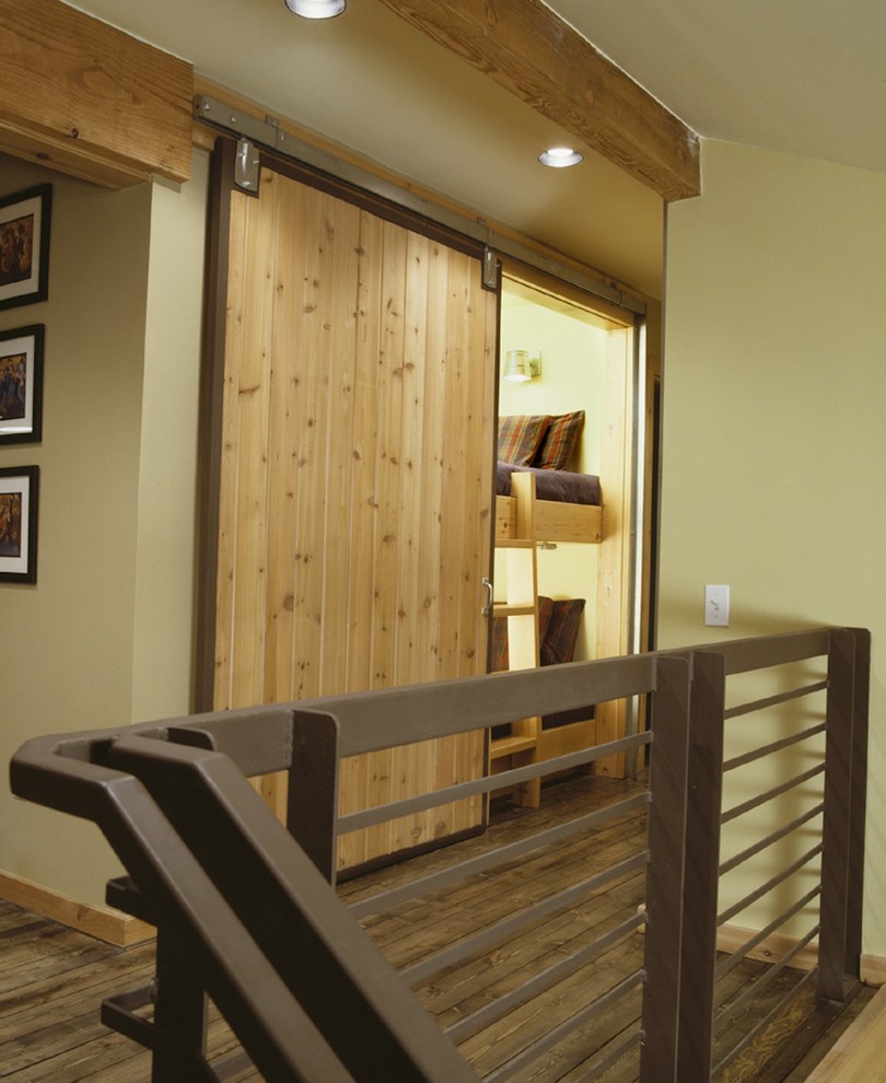 Hallway - small rustic dark wood floor hallway idea in Austin with green walls