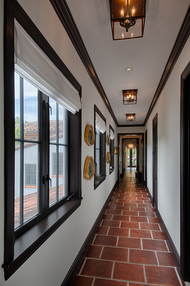 Inspiration for a contemporary terra-cotta tile hallway remodel in Miami