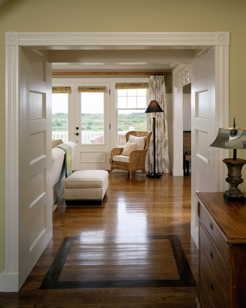 Inspiration for a huge coastal medium tone wood floor hallway remodel in Boston with beige walls