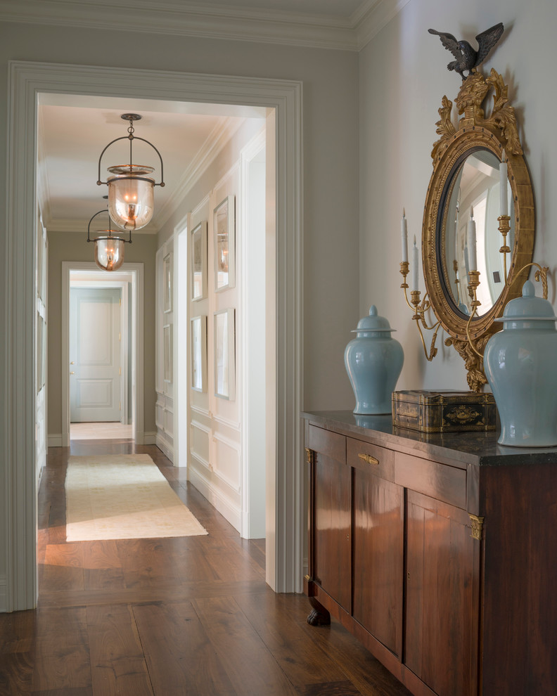 Example of a large dark wood floor hallway design in Jacksonville with white walls
