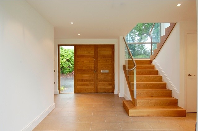 Example of a huge trendy hallway design in Kent with white walls