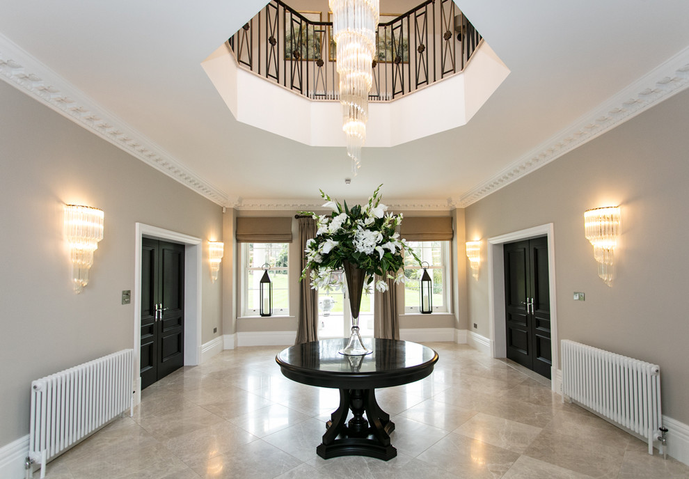 Large elegant marble floor and gray floor hallway photo in Surrey with gray walls