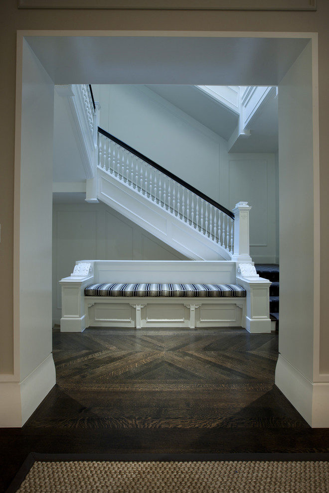 Inspiration for a contemporary dark wood floor hallway remodel in Chicago with white walls