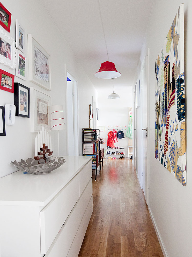 Inspiration for a large scandinavian hallway remodel in Stockholm with white walls