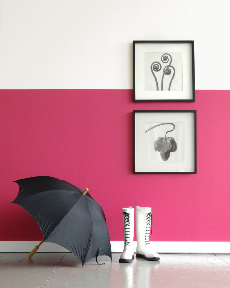 Inspiration for a modern concrete floor hallway remodel in Portland with pink walls