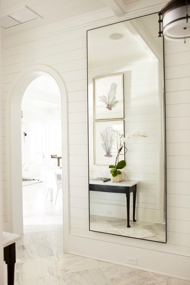 Inspiration for a marble floor hallway remodel in Charleston with white walls