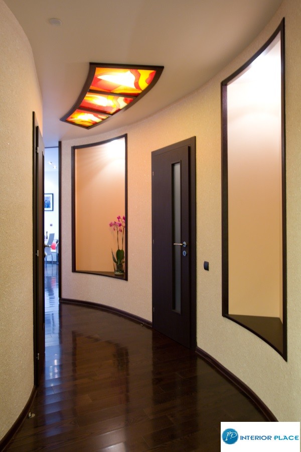 Example of a mid-sized classic dark wood floor hallway design in Philadelphia with beige walls