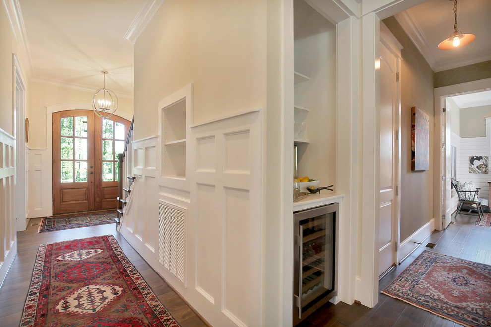 Example of a mid-sized arts and crafts dark wood floor hallway design in Richmond with yellow walls