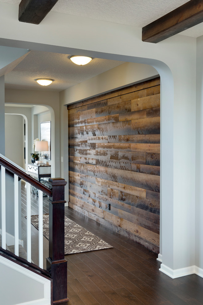 Example of a mountain style dark wood floor hallway design in Minneapolis with gray walls
