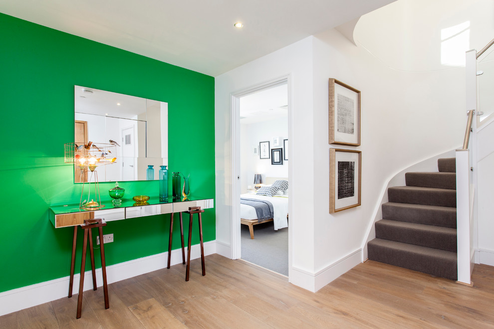 Trendy hallway photo in London with white walls