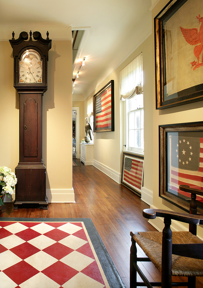 Inspiration for a mid-sized rustic dark wood floor and brown floor hallway remodel in Newark with beige walls