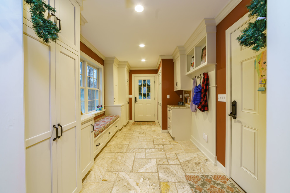 Small elegant travertine floor and beige floor hallway photo in Bridgeport with red walls