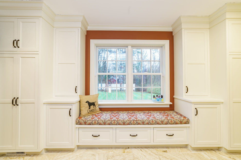 Small elegant travertine floor and beige floor hallway photo in Bridgeport with red walls