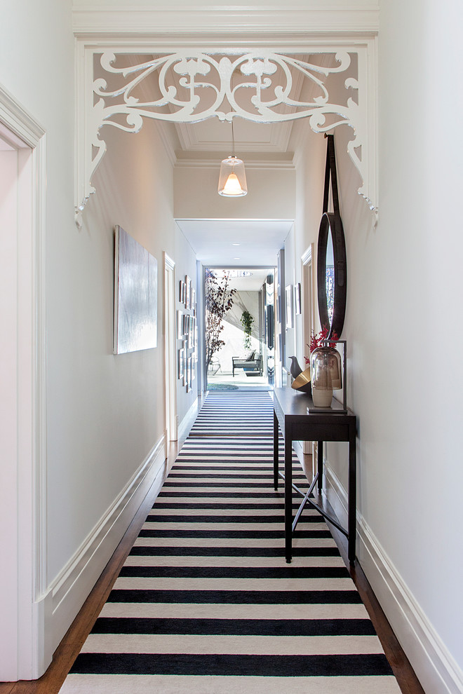Inspiration for a transitional hallway remodel in Melbourne with white walls