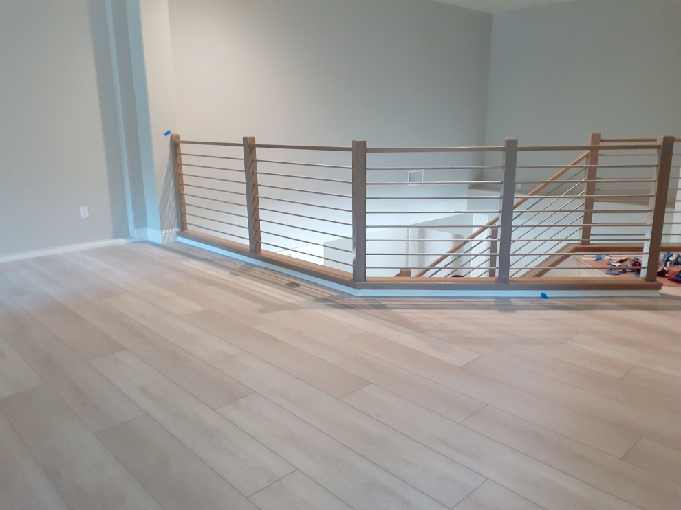 Hallway - vinyl floor and white floor hallway idea in Sacramento with gray walls