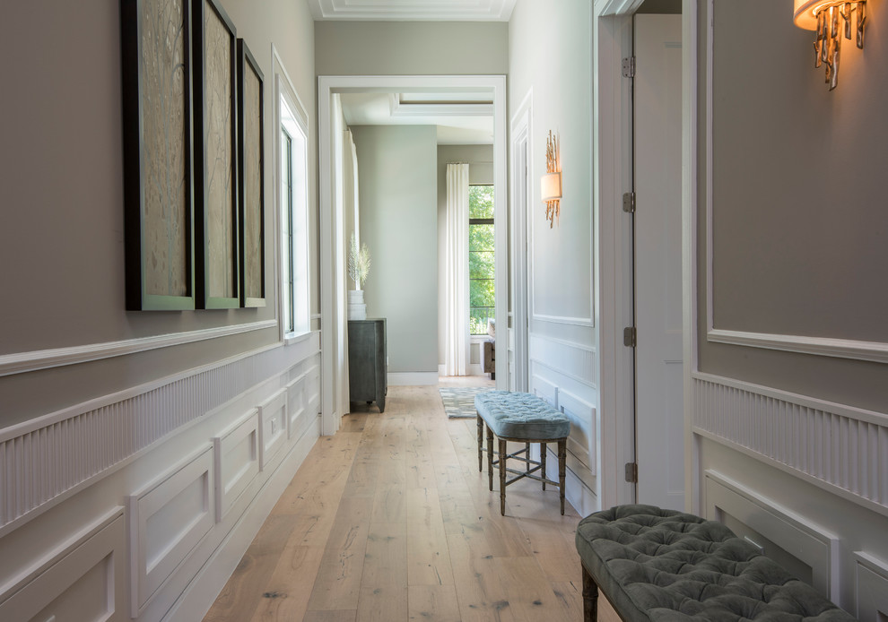 Transitional light wood floor and brown floor hallway photo in Orlando with gray walls