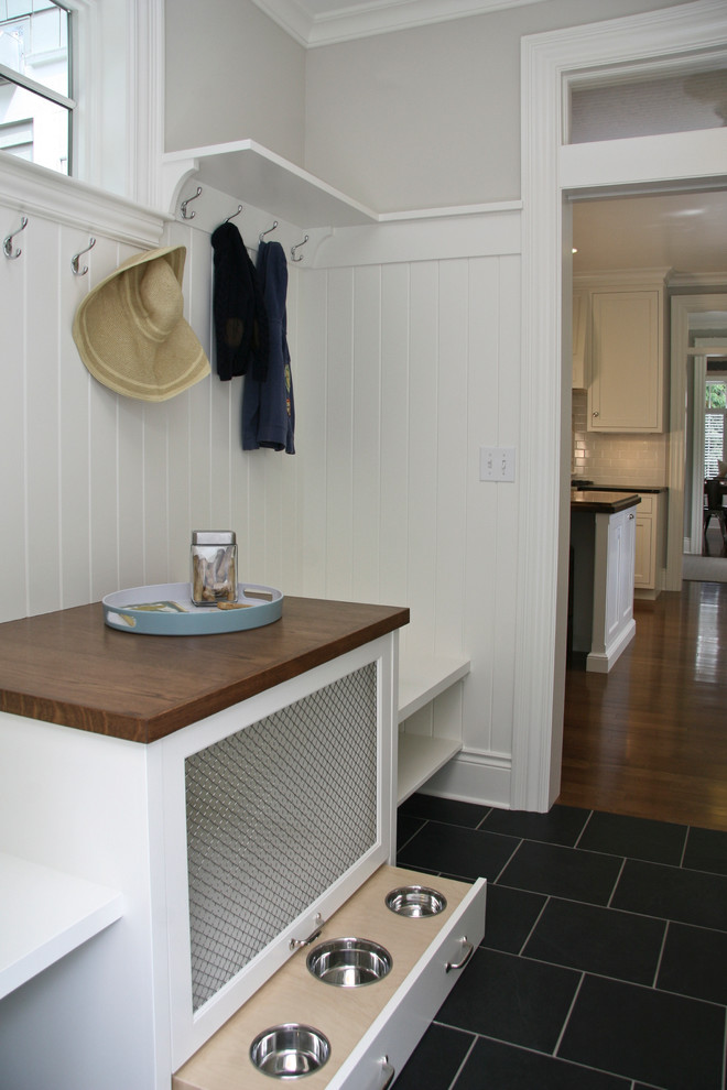 Example of a mid-sized transitional slate floor hallway design in Grand Rapids with white walls