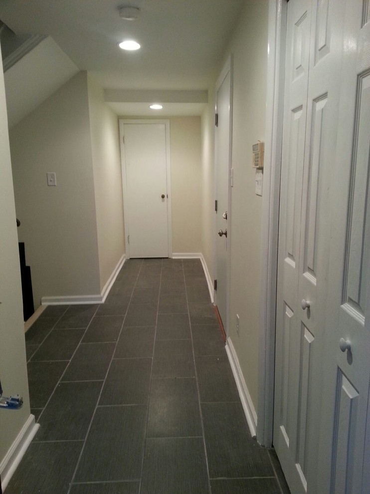 Inspiration for a small modern slate floor and gray floor hallway remodel in DC Metro with beige walls
