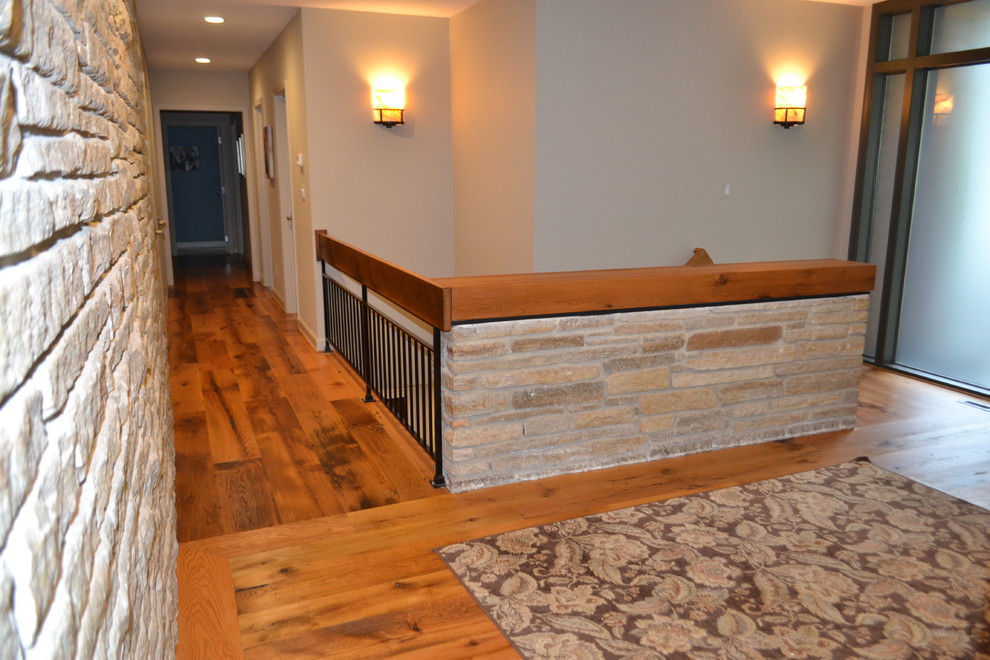 Hallway - large eclectic light wood floor and yellow floor hallway idea in Baltimore with beige walls