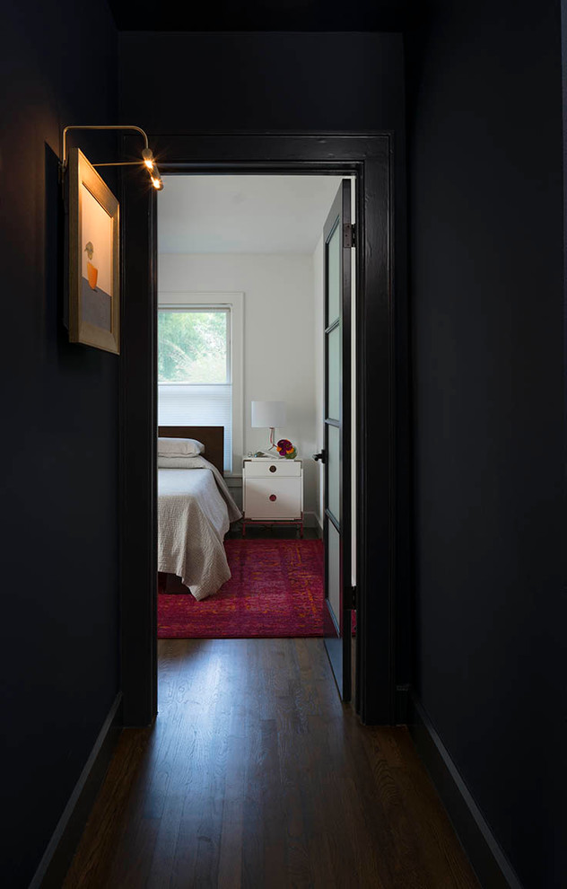 Inspiration for a small transitional medium tone wood floor hallway remodel in Austin with blue walls