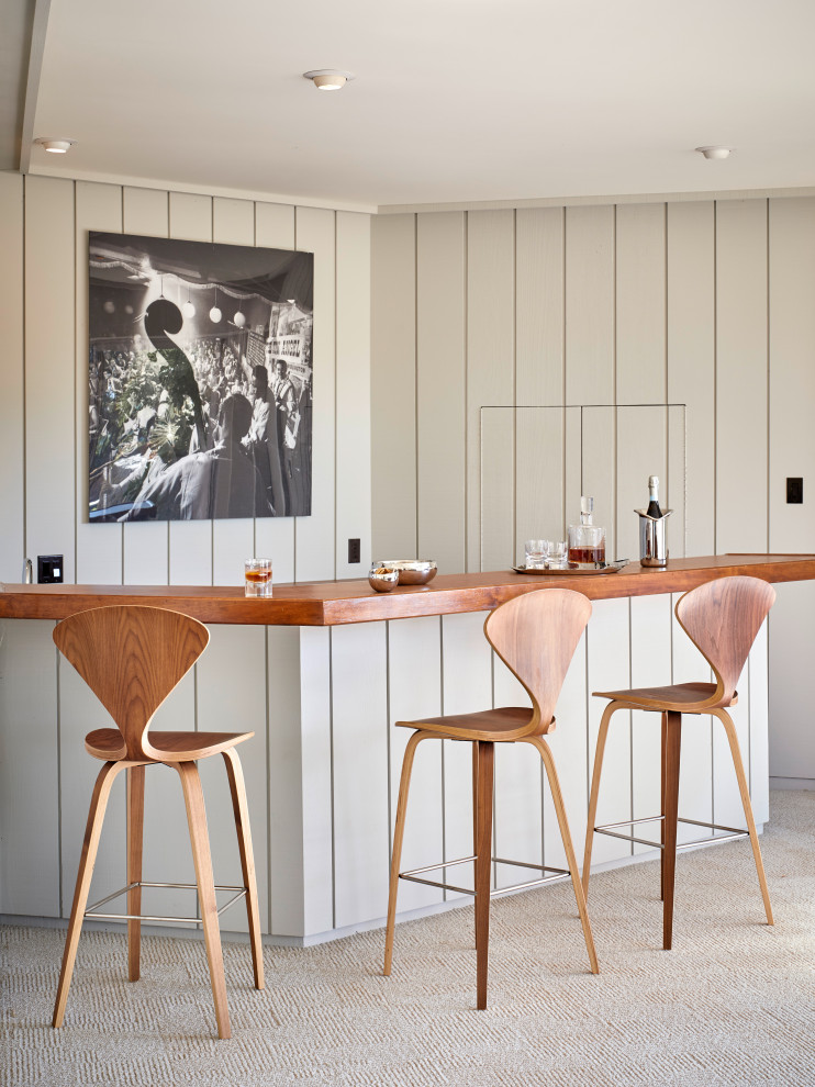 Inspiration for a large retro l-shaped breakfast bar in San Francisco with a built-in sink, flat-panel cabinets, grey cabinets, wood worktops, grey splashback, wood splashback, carpet and beige floors.