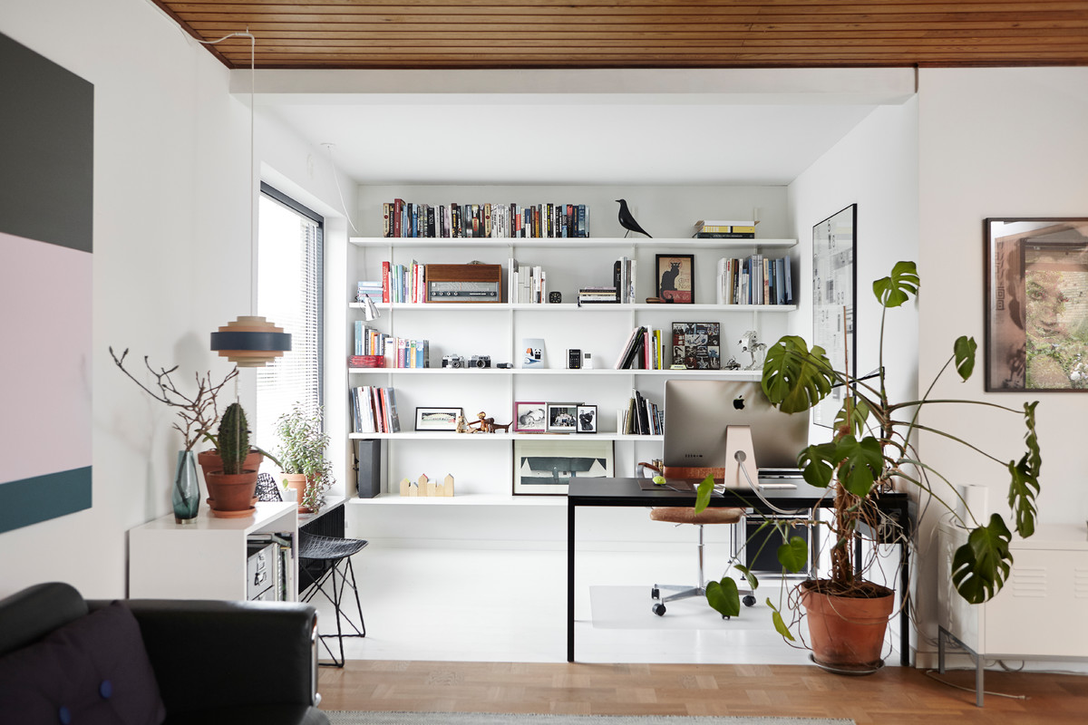 Design ideas for a large retro study in Aarhus with white walls, a freestanding desk and multi-coloured floors.