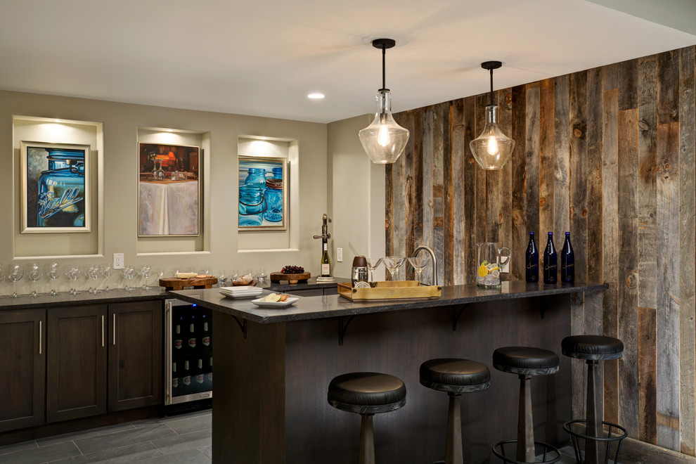 This is an example of a rustic breakfast bar in New York with dark wood cabinets and shaker cabinets.