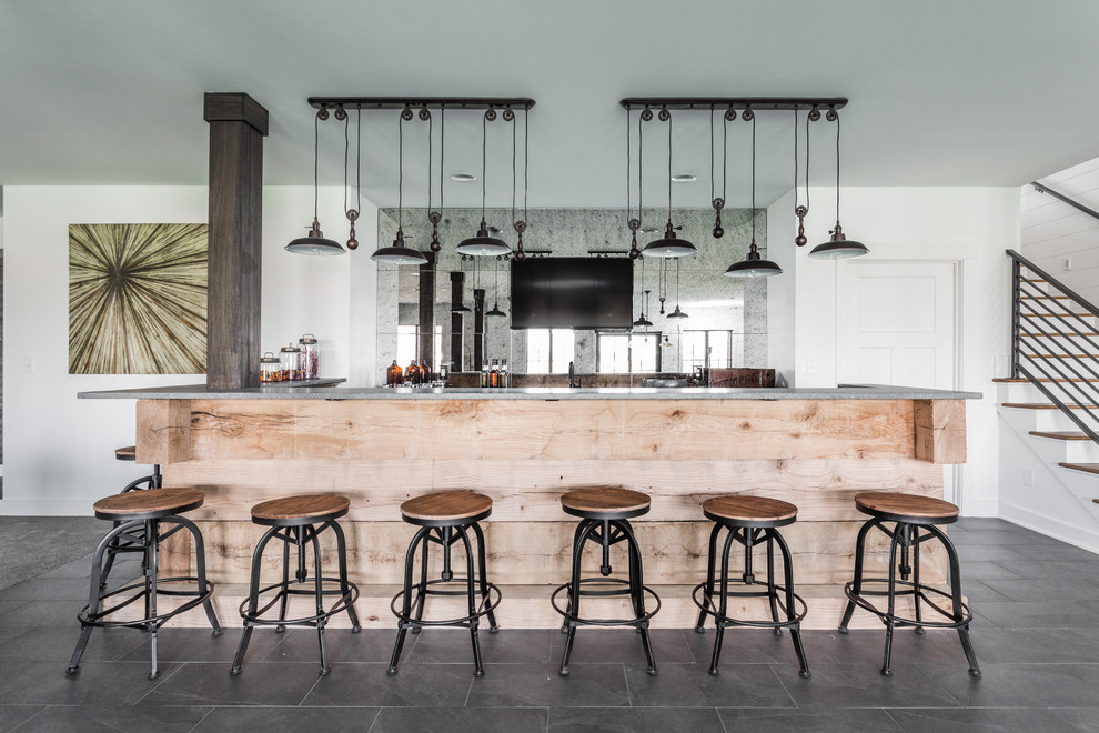 Large rural l-shaped wet bar in Indianapolis with light wood cabinets, concrete worktops, multi-coloured splashback, ceramic flooring, grey floors and mirror splashback.