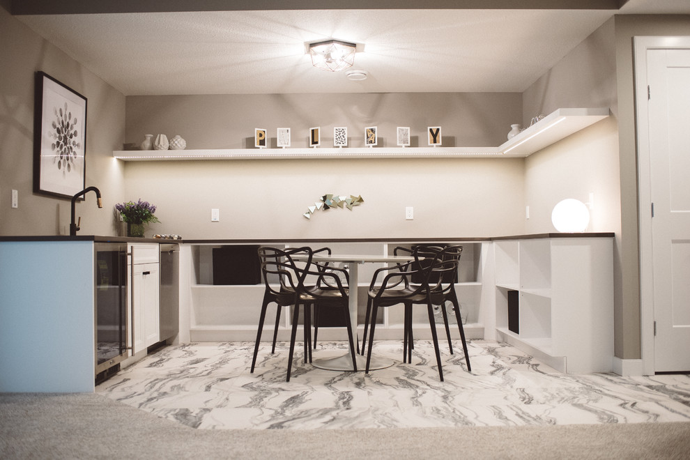 This is an example of a medium sized modern u-shaped breakfast bar in Edmonton with a submerged sink, open cabinets, white cabinets, engineered stone countertops, marble flooring, white floors and grey worktops.