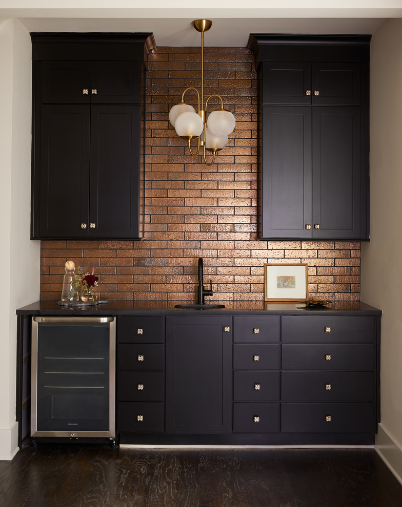 Inspiration for a contemporary single-wall wet bar in Nashville with shaker cabinets, black cabinets, metro tiled splashback, dark hardwood flooring, black floors and a feature wall.