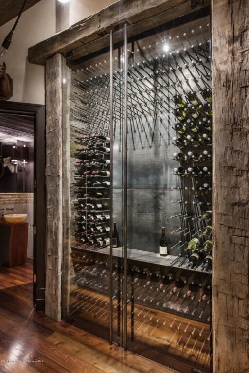 Inspiration for an industrial wine cellar remodel in Denver