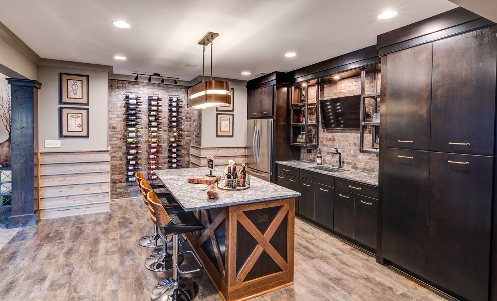 Medium sized traditional galley wet bar in Indianapolis with a submerged sink, flat-panel cabinets, black cabinets, granite worktops and medium hardwood flooring.