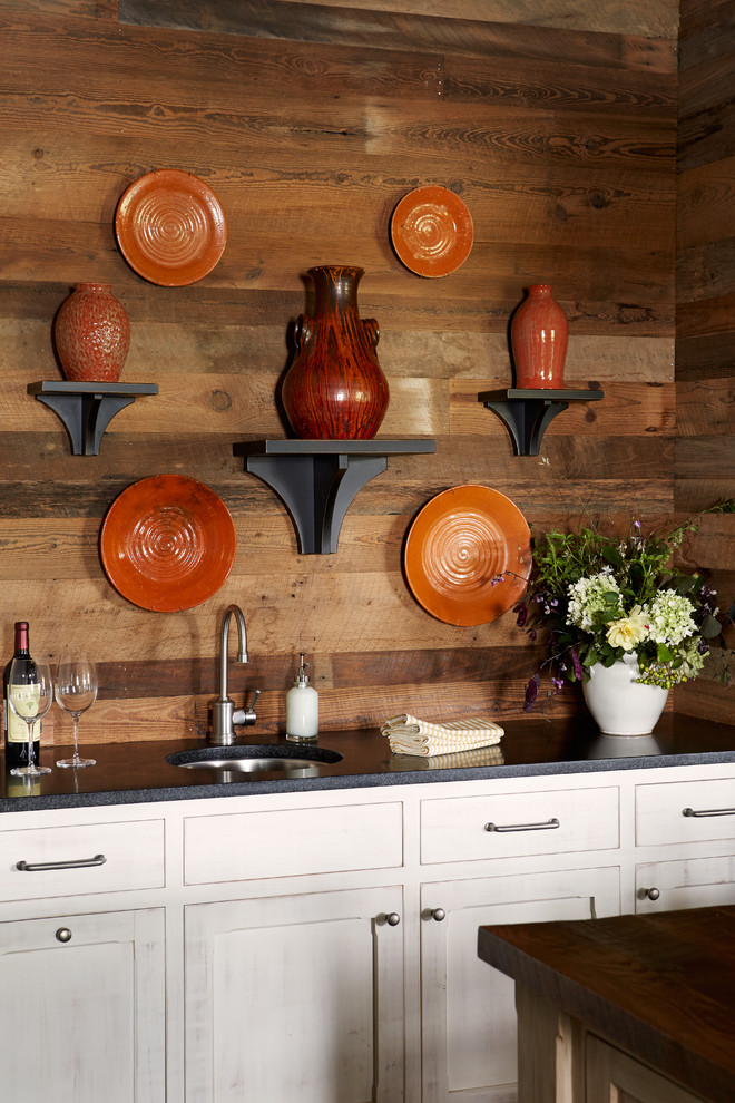 Inspiration for a rustic wet bar in Other with a submerged sink, shaker cabinets, white cabinets and granite worktops.