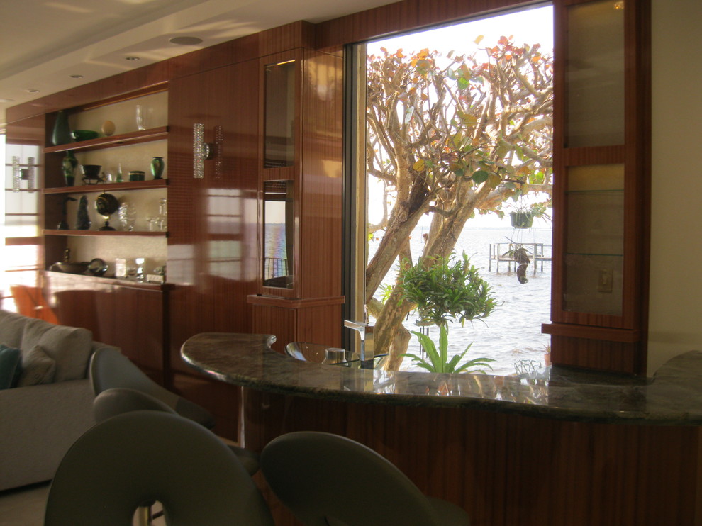 This is an example of a contemporary home bar in Miami.