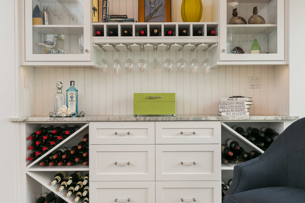 Inspiration for a mid-sized coastal single-wall wet bar remodel in Baltimore with no sink, shaker cabinets, white cabinets, white backsplash and granite countertops