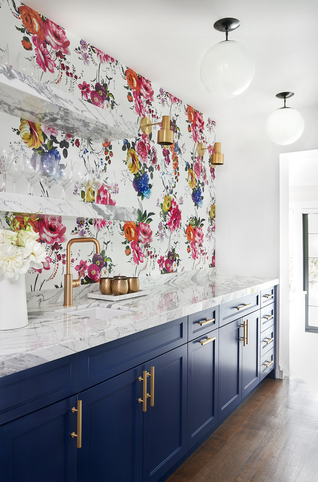 Photo of a traditional single-wall wet bar in Toronto with a submerged sink, shaker cabinets, blue cabinets, multi-coloured splashback and dark hardwood flooring.