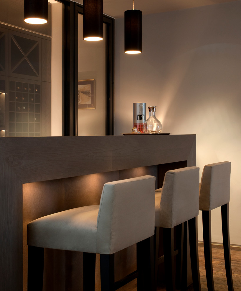 Inspiration for a contemporary home bar remodel in London