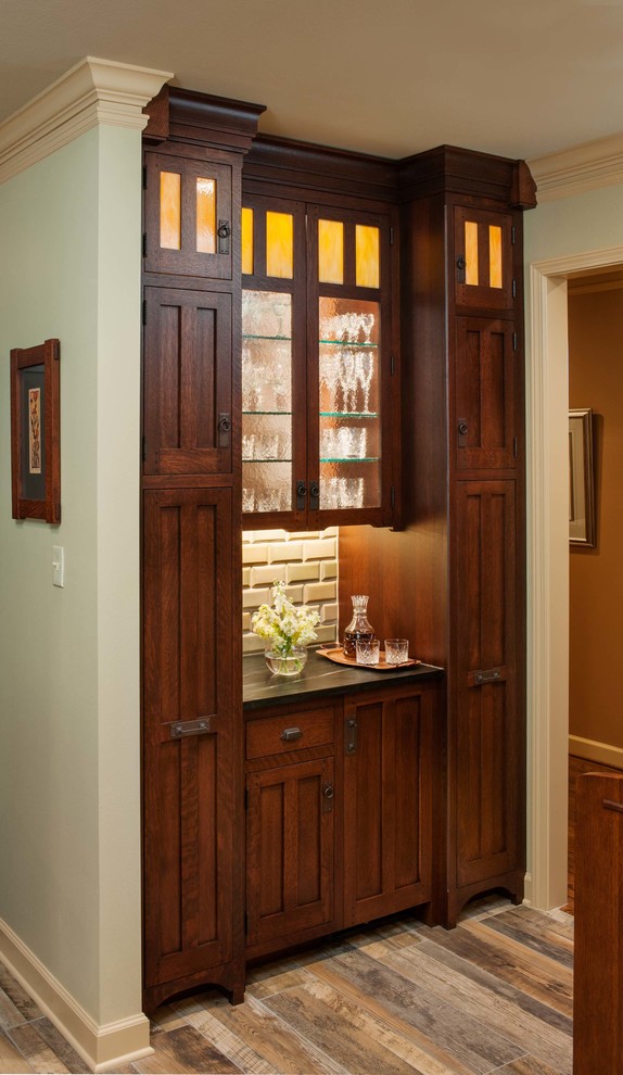 Example of an arts and crafts single-wall home bar design in Burlington