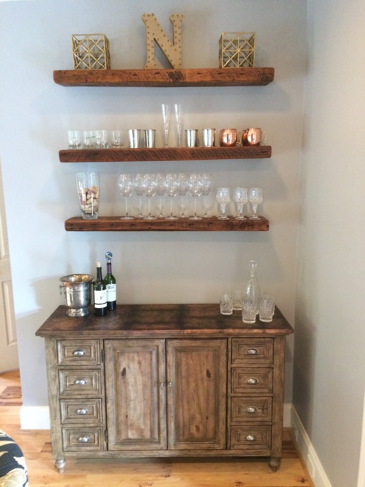 Example of a small transitional single-wall light wood floor and beige floor bar cart design in Charlotte with brown cabinets, wood countertops, gray backsplash and brown countertops