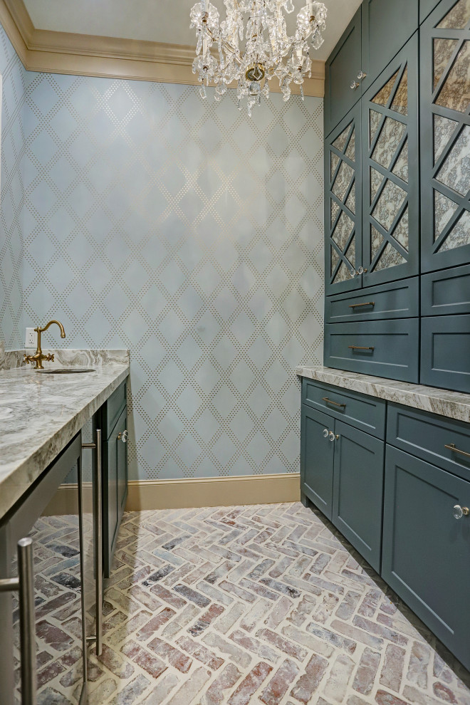 This is an example of a medium sized traditional galley wet bar in Houston with a built-in sink, shaker cabinets, green cabinets, engineered stone countertops, brick flooring and multicoloured worktops.