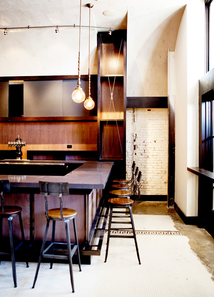Example of a mid-sized urban home bar design in Los Angeles with flat-panel cabinets, concrete countertops, brown backsplash and wood backsplash
