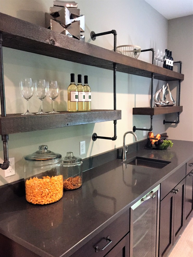 Example of a mid-sized transitional single-wall carpeted home bar design in Minneapolis with an undermount sink, shaker cabinets, granite countertops and dark wood cabinets