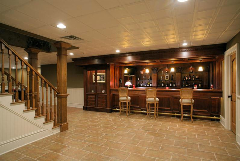 Seated home bar - huge traditional single-wall travertine floor and beige floor seated home bar idea in New York with open cabinets, medium tone wood cabinets, wood countertops, brown backsplash and wood backsplash