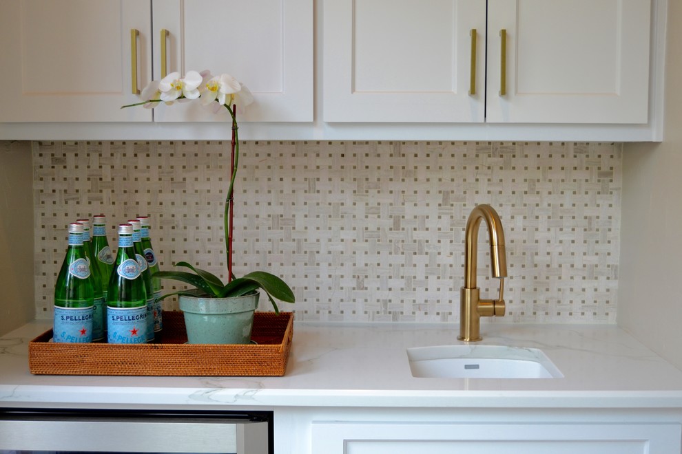 Inspiration for a small transitional galley dark wood floor wet bar remodel in Dallas with an undermount sink, shaker cabinets, white cabinets, quartz countertops, gray backsplash and ceramic backsplash