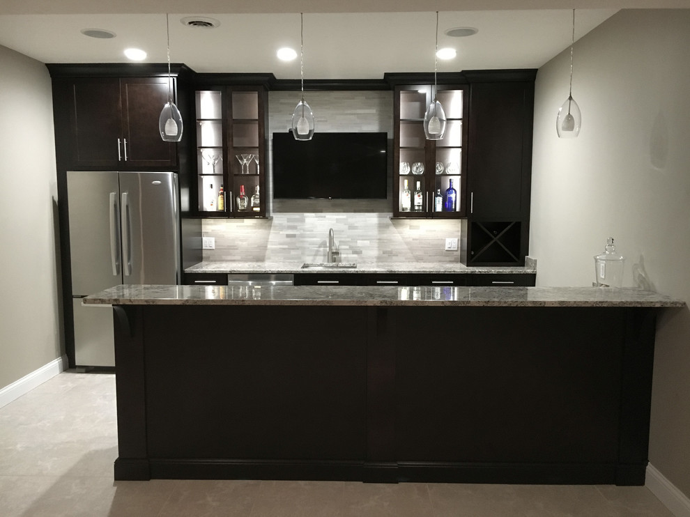 Photo of a large modern single-wall breakfast bar in Other with a submerged sink, shaker cabinets, dark wood cabinets, granite worktops, grey splashback, mosaic tiled splashback, porcelain flooring and grey floors.