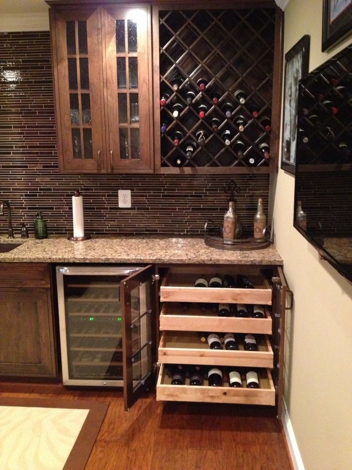 Wine cellar - huge traditional medium tone wood floor and brown floor wine cellar idea in DC Metro
